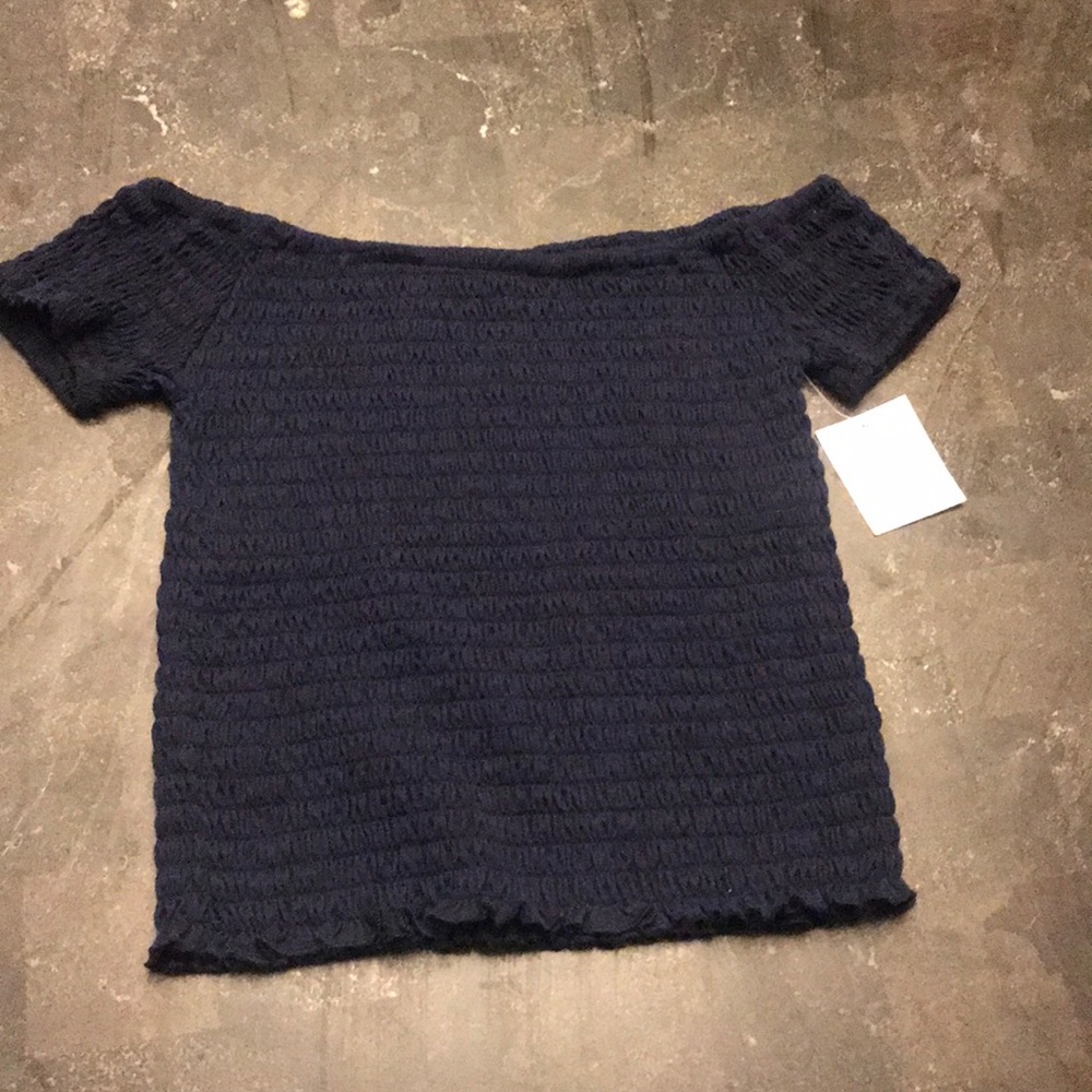 Off the shoulder tight fitting top.